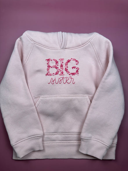 Big and little sibling stitched on clothing