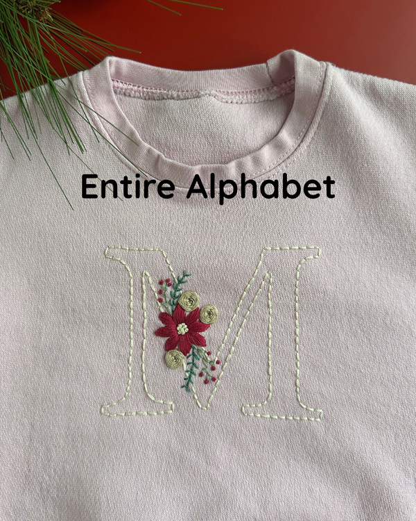 Light pink sweatshirt with embroidered floral initial letters and stitched outline