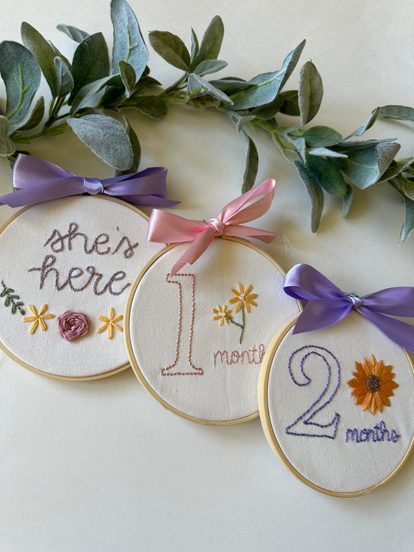 Floral embroidery hoop milestone set with ribbon bows and 'here' text