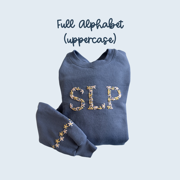 Dark blue sweatshirt with embroidered uppercase alphabet letters across the chest