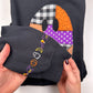Dark hoodie sleeve cuff with colorful "boo" embroidery