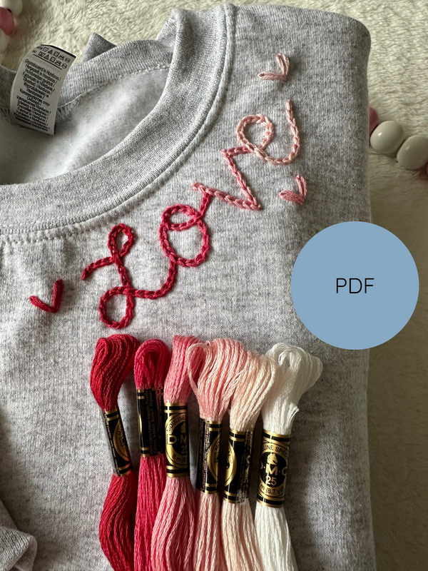 Heather gray sweatshirt with red-pink heart cursive neckline embroidery and floss